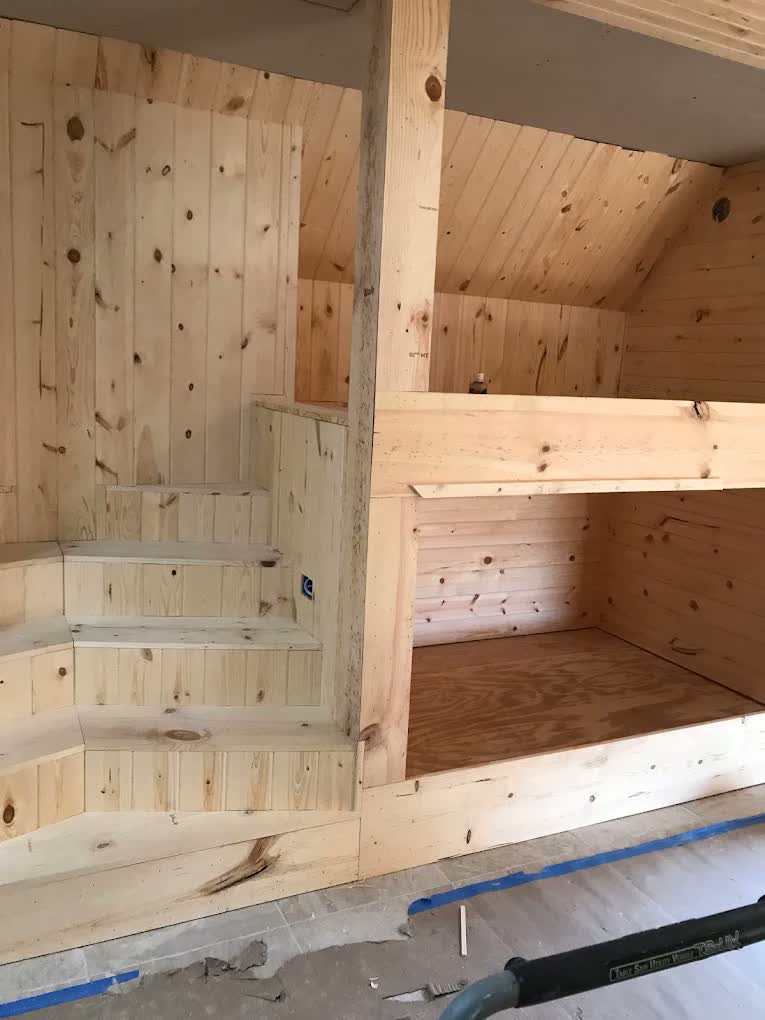 Custom built-in bunk room with stairs by Asier Services