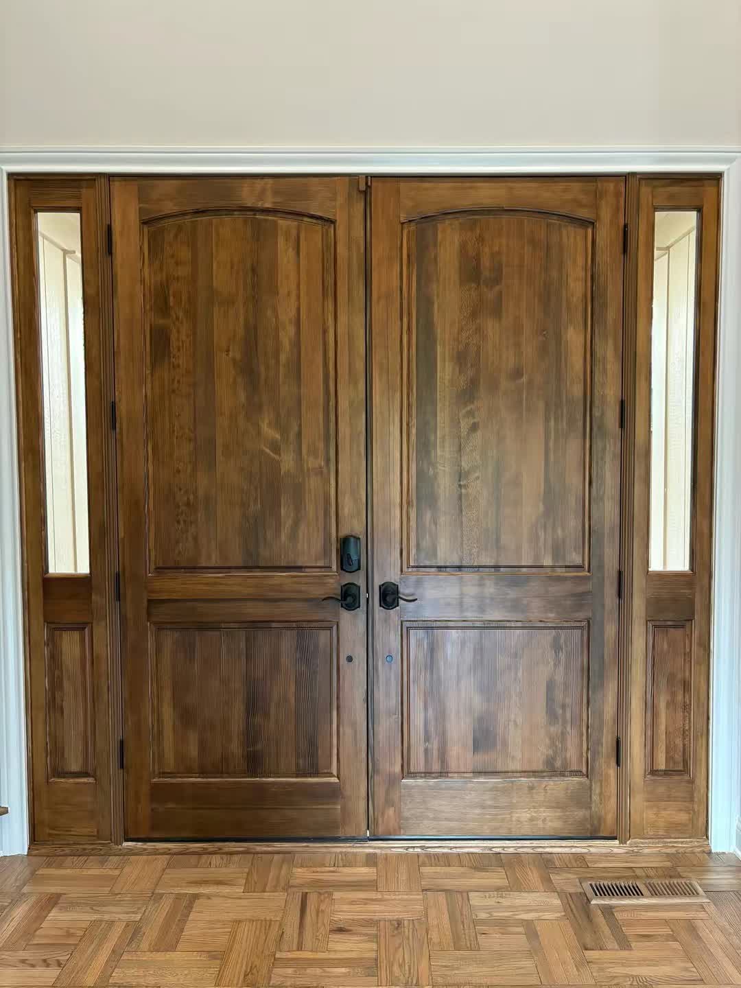 Finished stained double entry doors, interior view by Asier Services