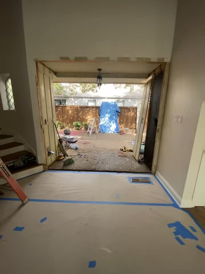 Entryway door opening mid-installation, interior view by Asier Services