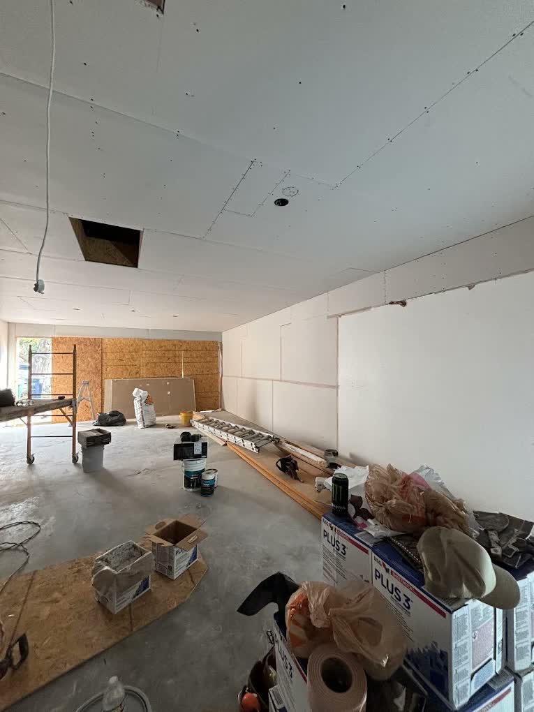 Drywall installation in progress by Asier Services